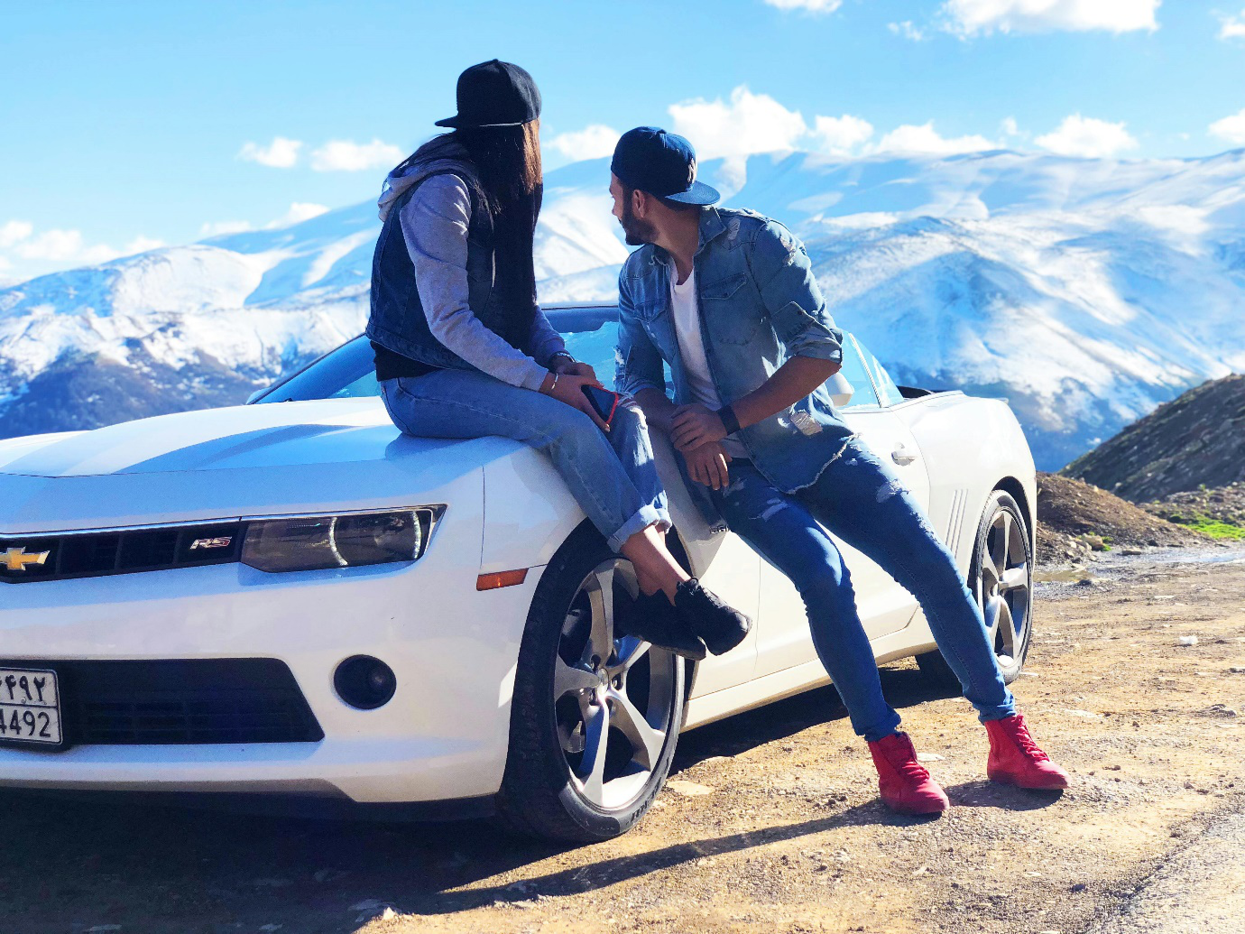 a couple near their car