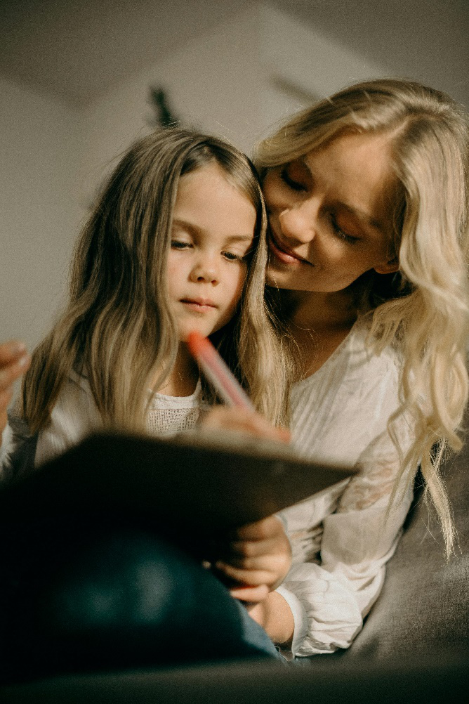 a girl writing on a paper