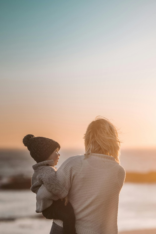 a woman carrying child