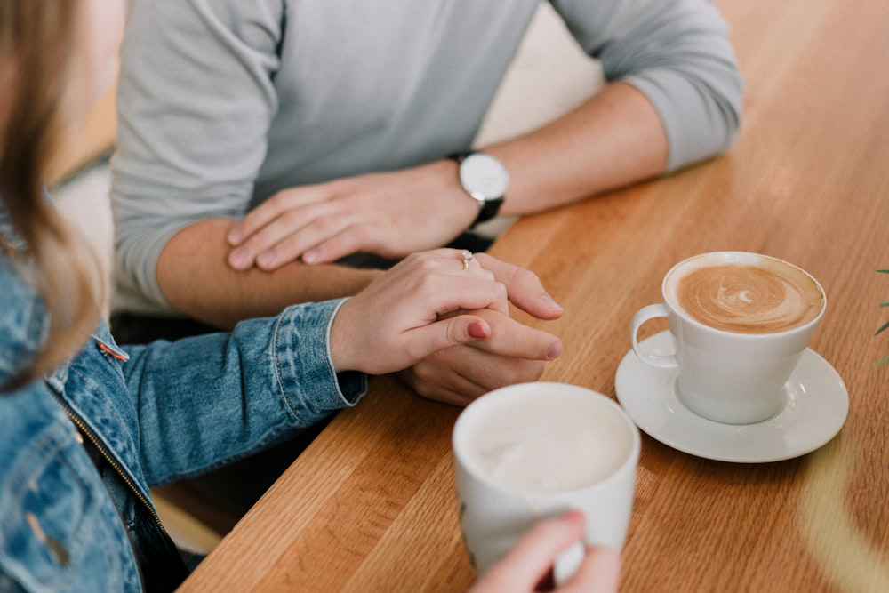 A couple drinking coffee after getting addiction treatment in Barrow County