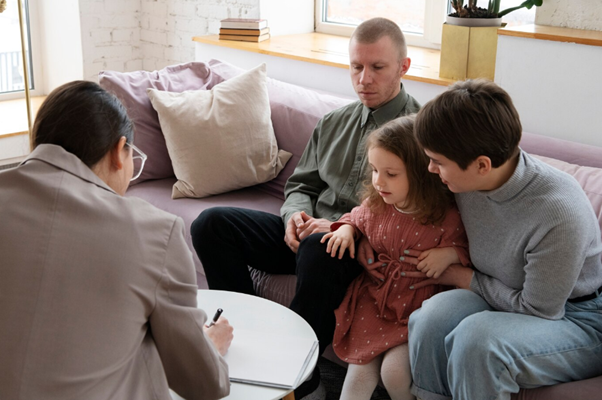 parents and their child attending therapy