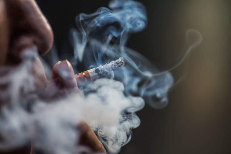 Individual smoking alone, representing isolation and the emotional burden of substance use.